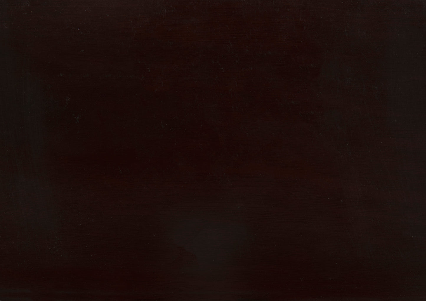 Dark brown polished wooden table surface with visible grain