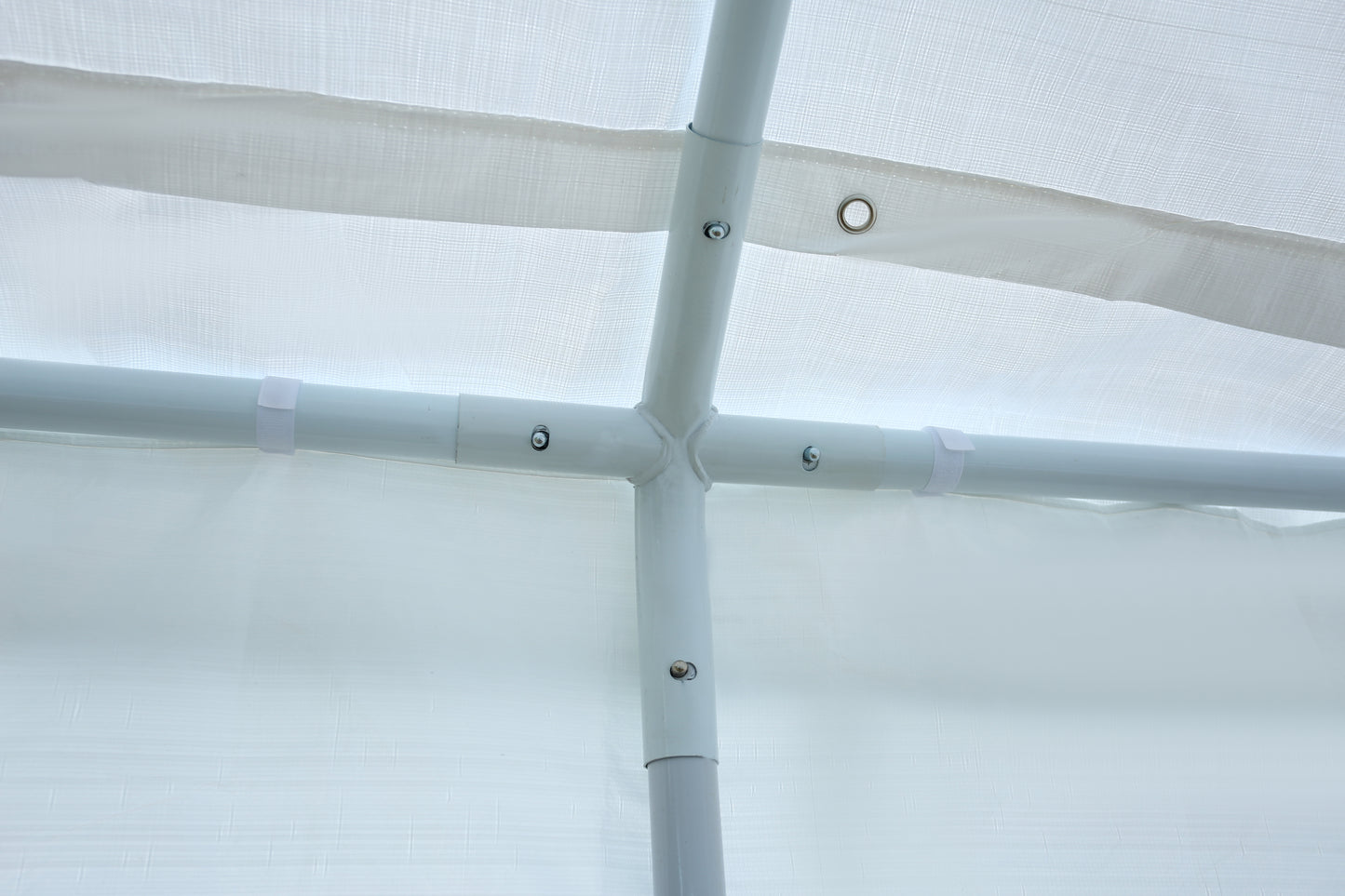 White PVC pipe cross fitting for carport structure assembly