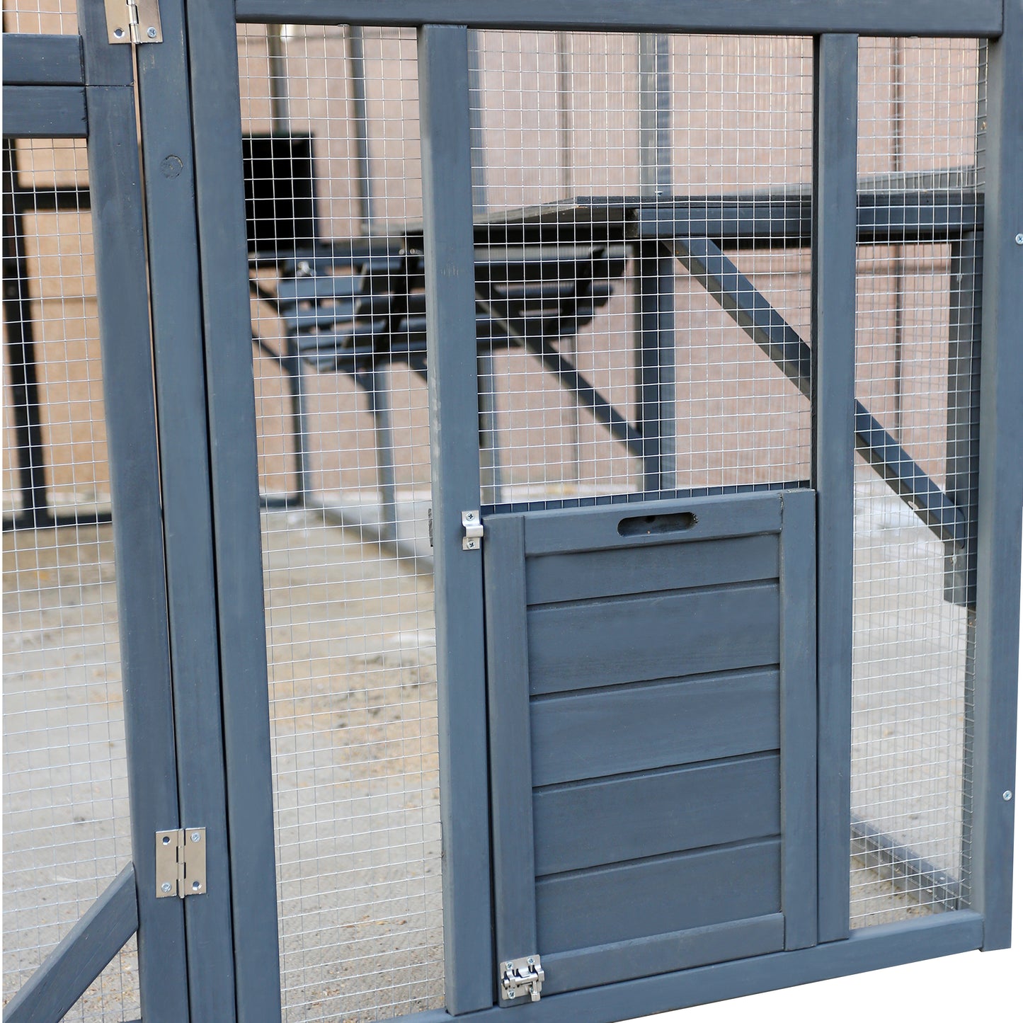 Dark gray wooden pet run with wire mesh and a small wooden door designed for outdoor use