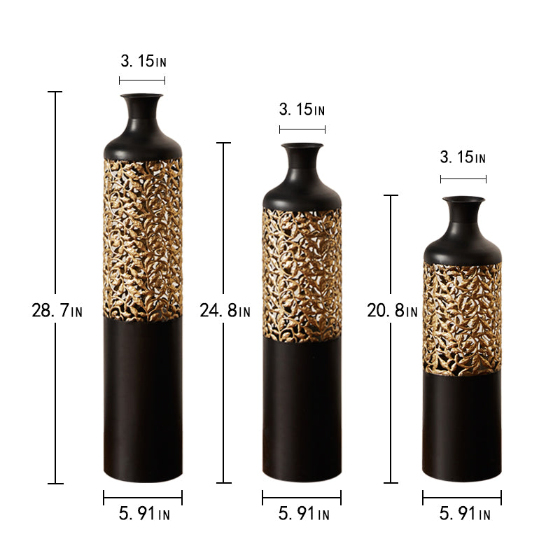 Tall black metal vase with gold filigree cutout detail and slim neck