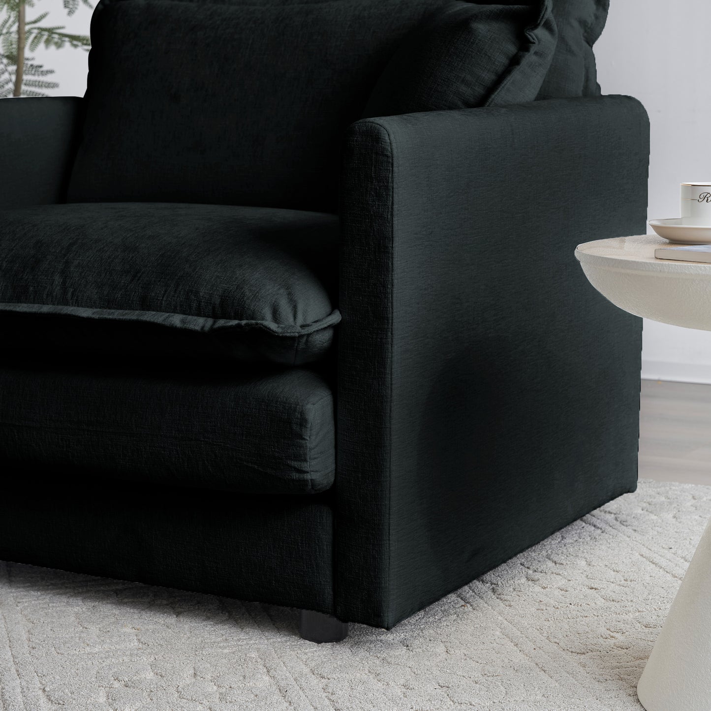 Dark charcoal textured fabric sofa with plush seat and back cushions perfect for living rooms