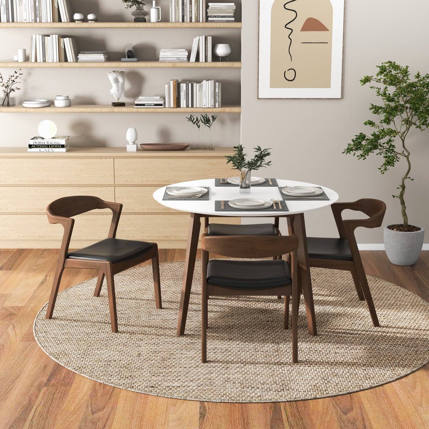 Modern walnut dining chairs with black faux leather seats arranged around a white round dining table