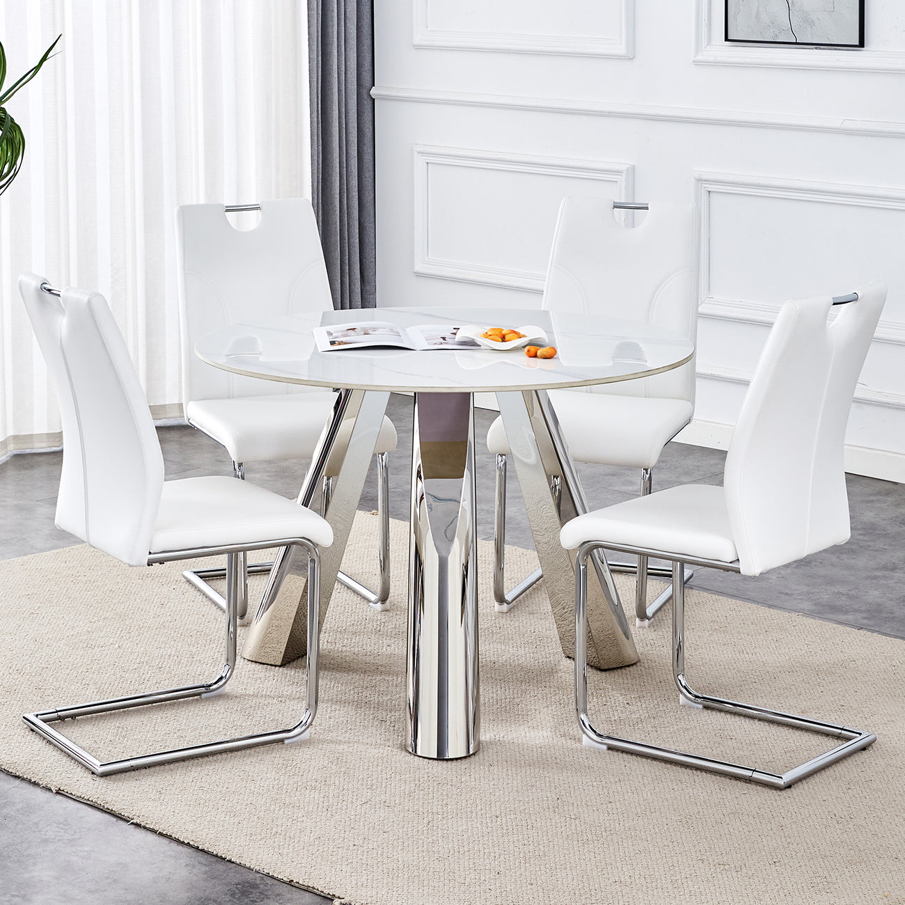 White faux leather dining chairs with chrome legs