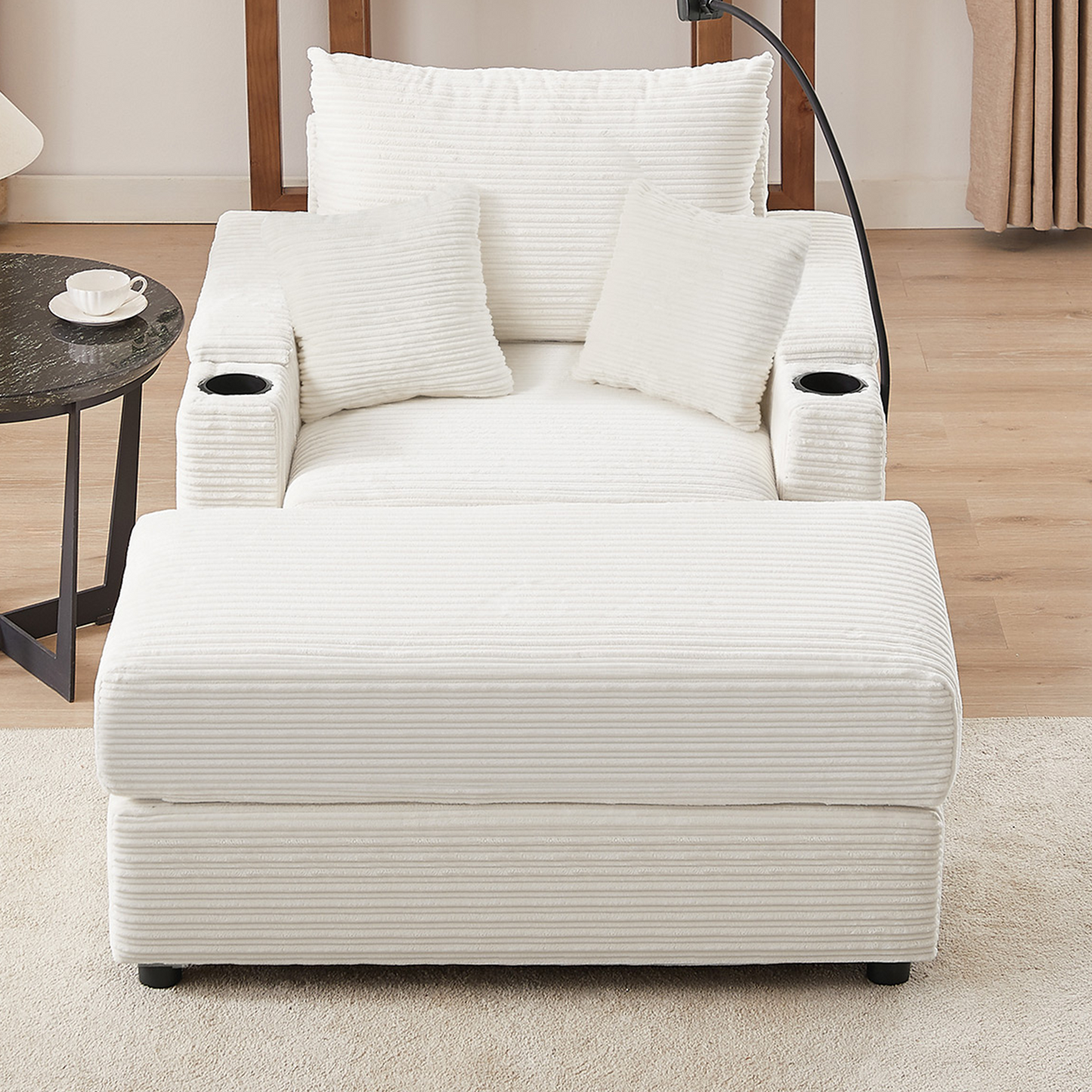 Cozy white corduroy armchair with matching ottoman and two throw pillows