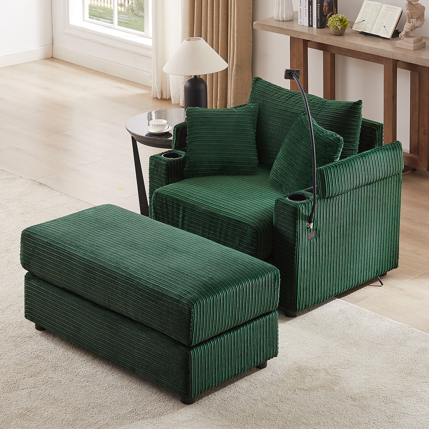 Deep green corduroy armchair with ottoman and matching accent pillows