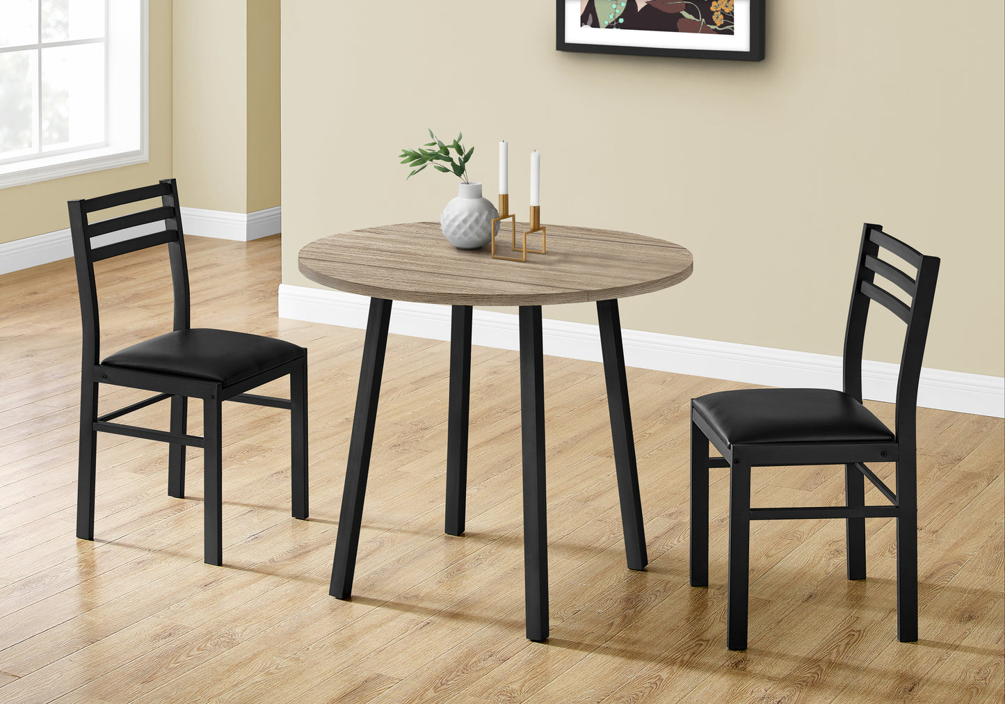 Round oak dining table with black metal chairs