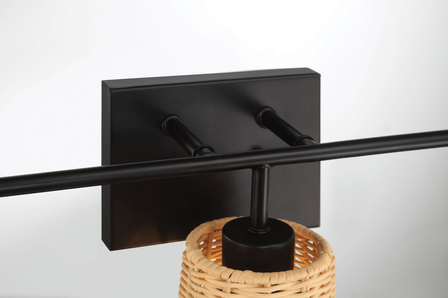 Matte black wall sconce with a textured woven shade for ambient lighting