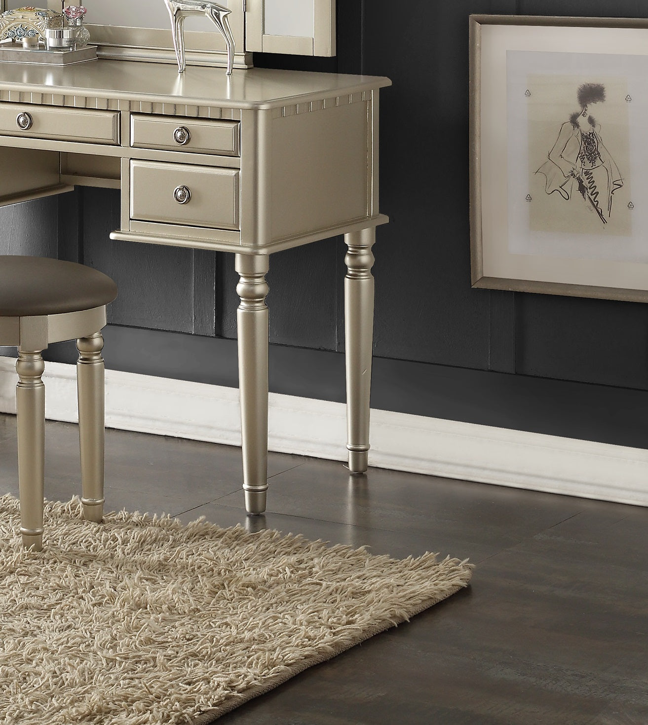 Champagne vanity table with ornate drawers and carved legs
