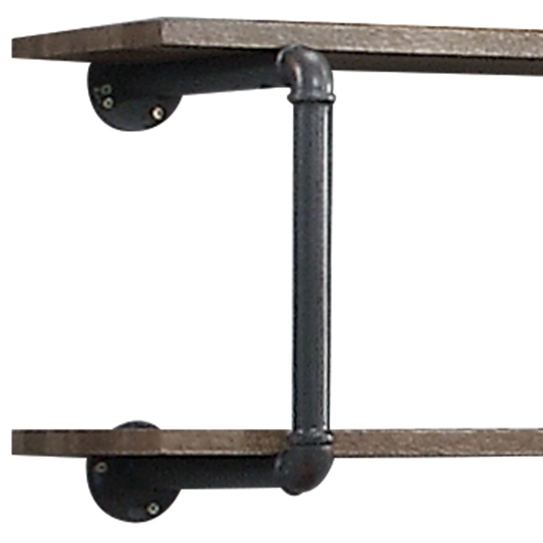 Rustic wooden shelf with industrial black pipe brackets
