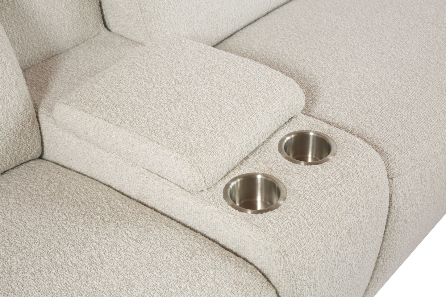 Closeup of beige fabric sofa armrest with two integrated stainless steel cup holders