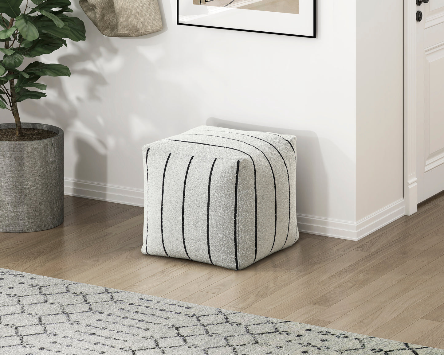 Textured white cube ottoman with black vertical stripes perfect for footrest