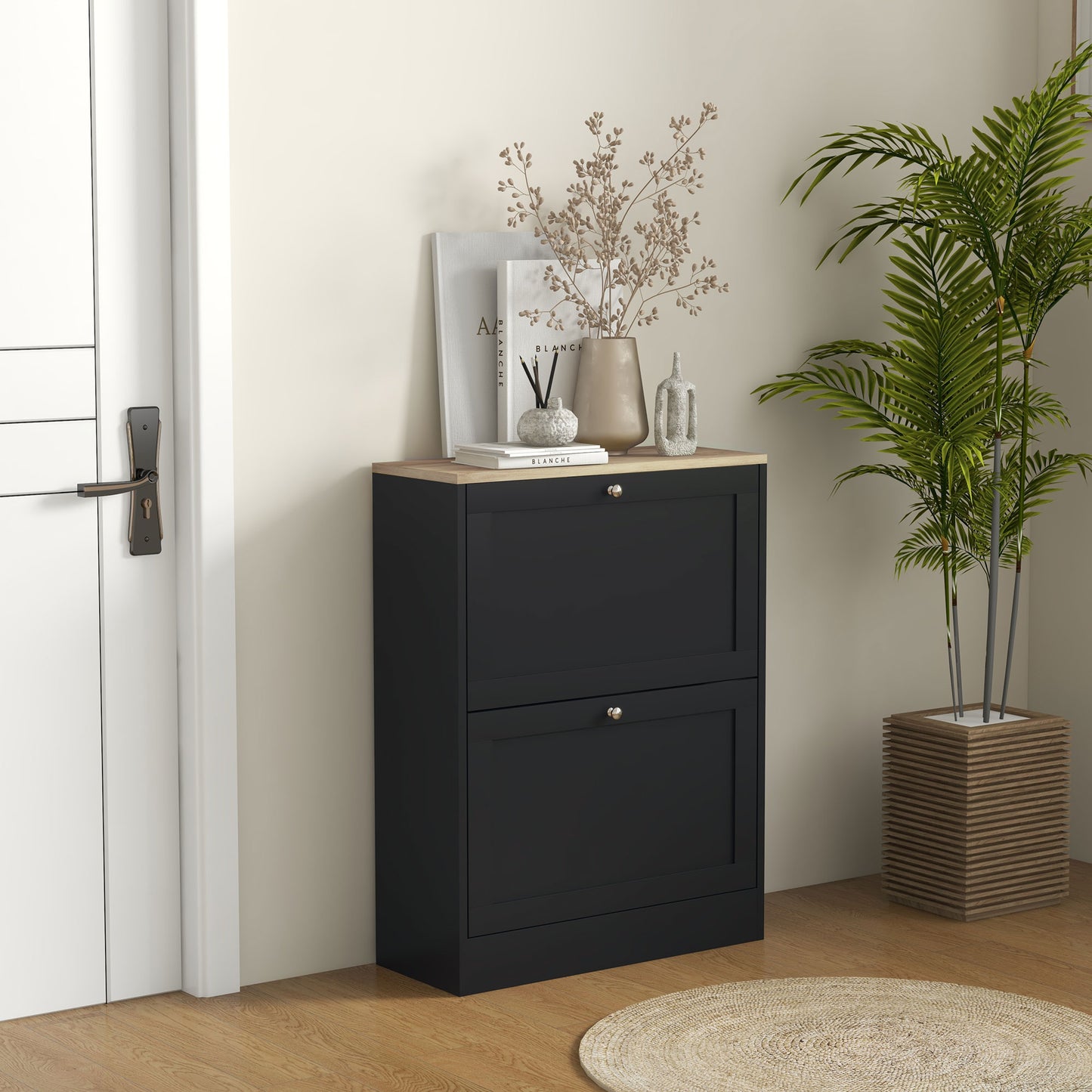 Black narrow shoe cabinet with two flipout doors and natural wood top for entryway storage