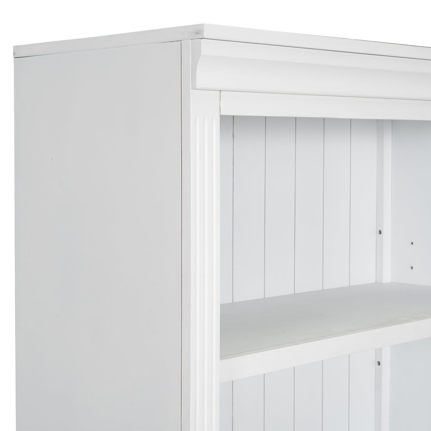Closeup of white wooden bookshelf with decorative molding and slatted back panel