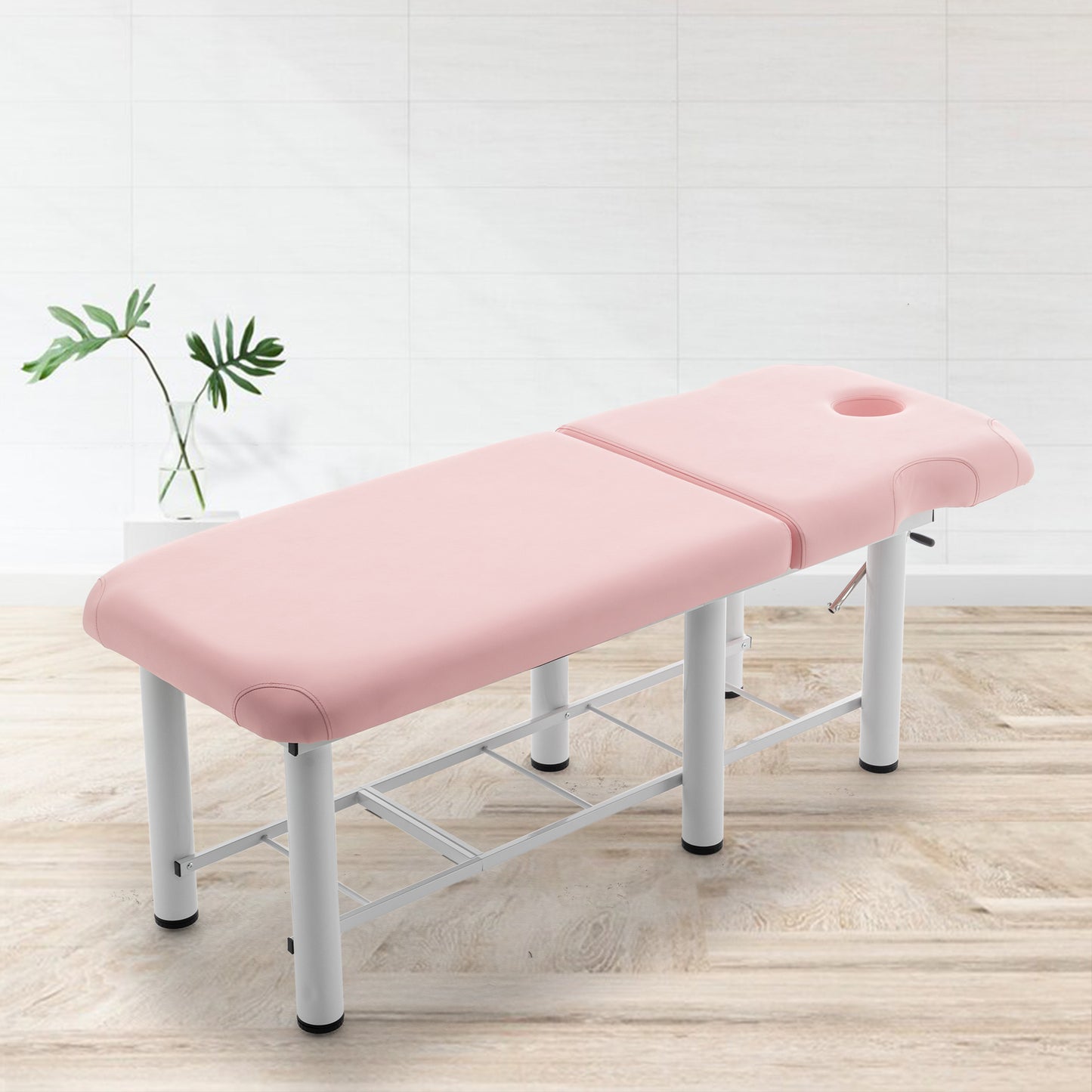 Light pink massage table with adjustable face cradle and white metal frame