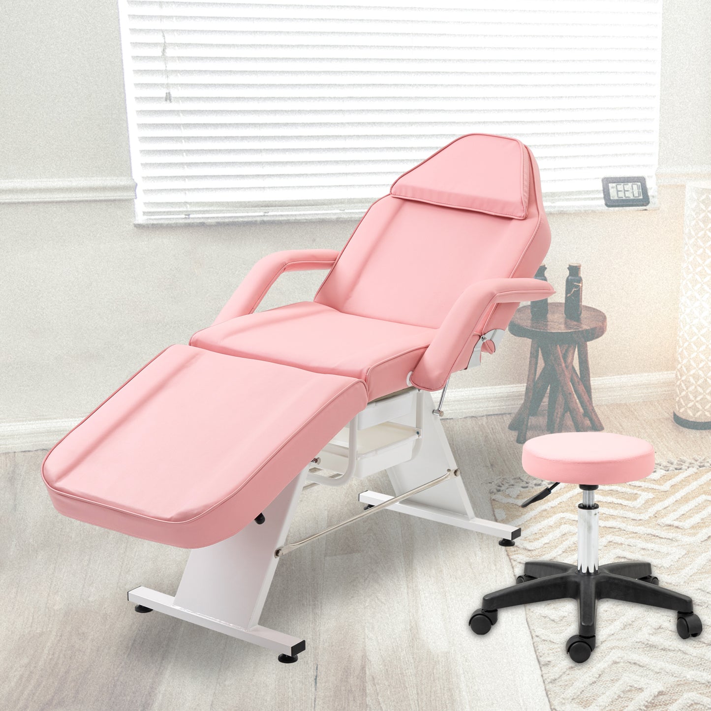 Adjustable pink spa bed with a matching stool ideal for beauty salons and massage therapy