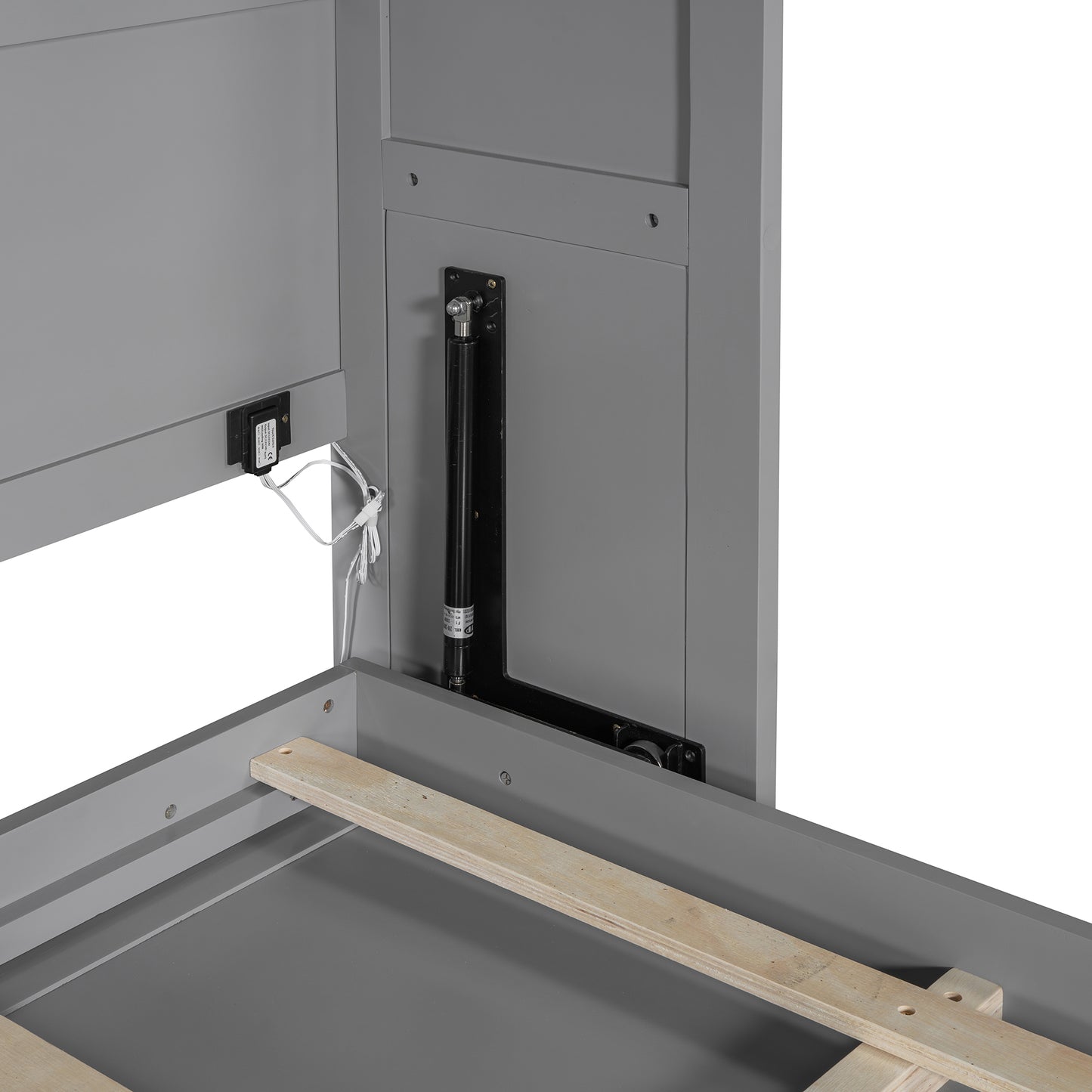 Gray bed frame detail showing gas lift mechanism