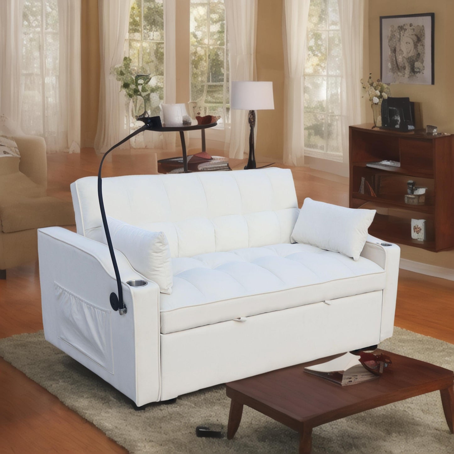 White convertible sofa with tufted cushions and attached cup holders ideal for small spaces