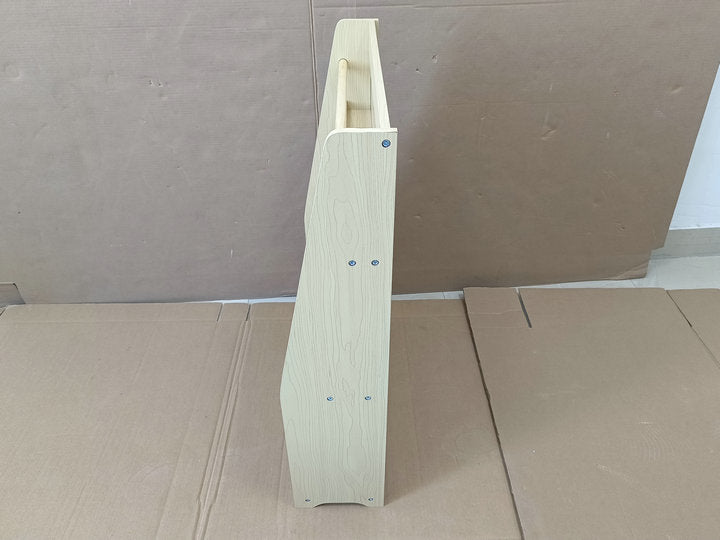 Light wood bookshelf angled view with visible screw fasteners for nursery decor