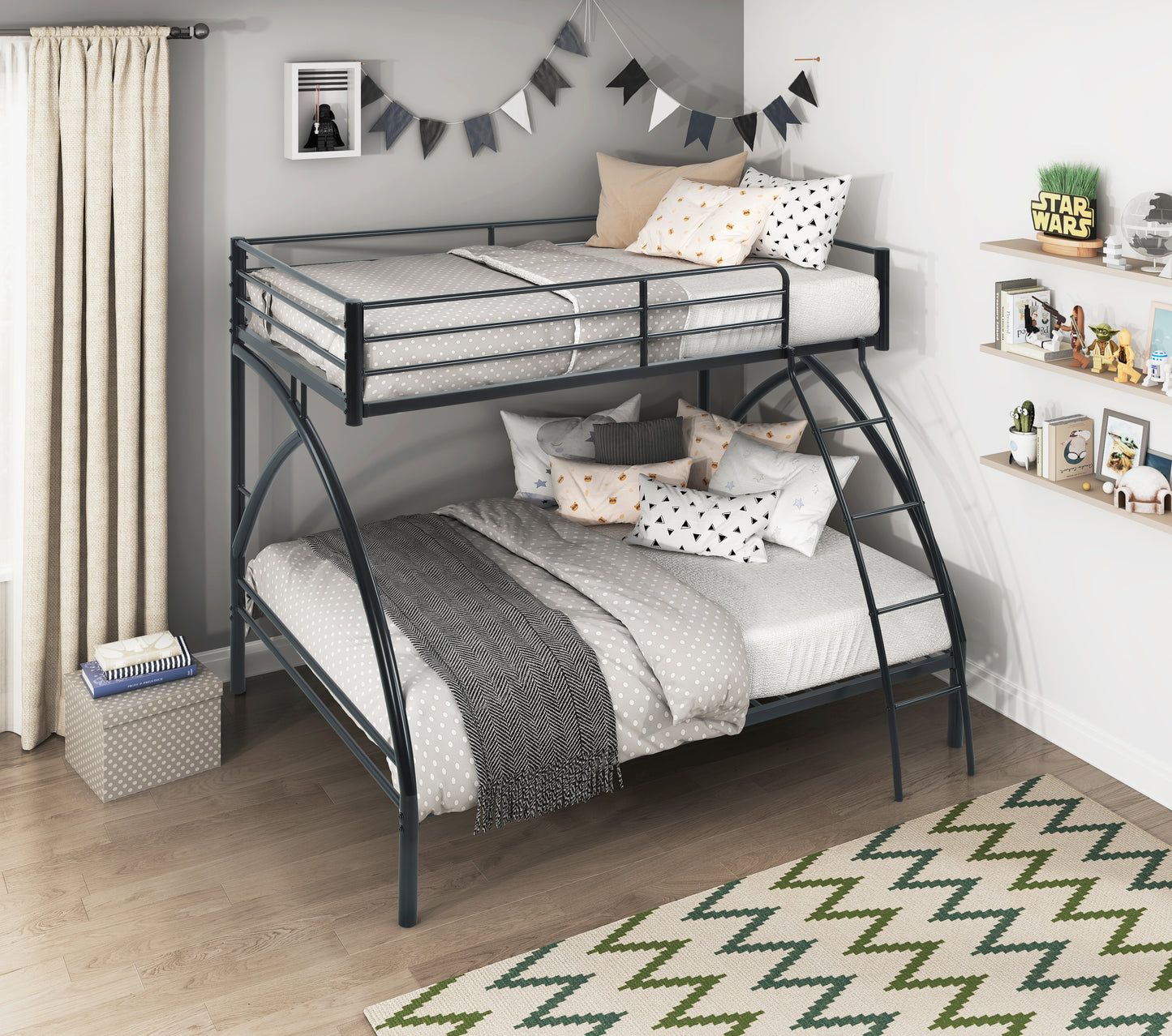 Black metal twin over twin bunk bed with grey polka dot bedding and decorative pillows