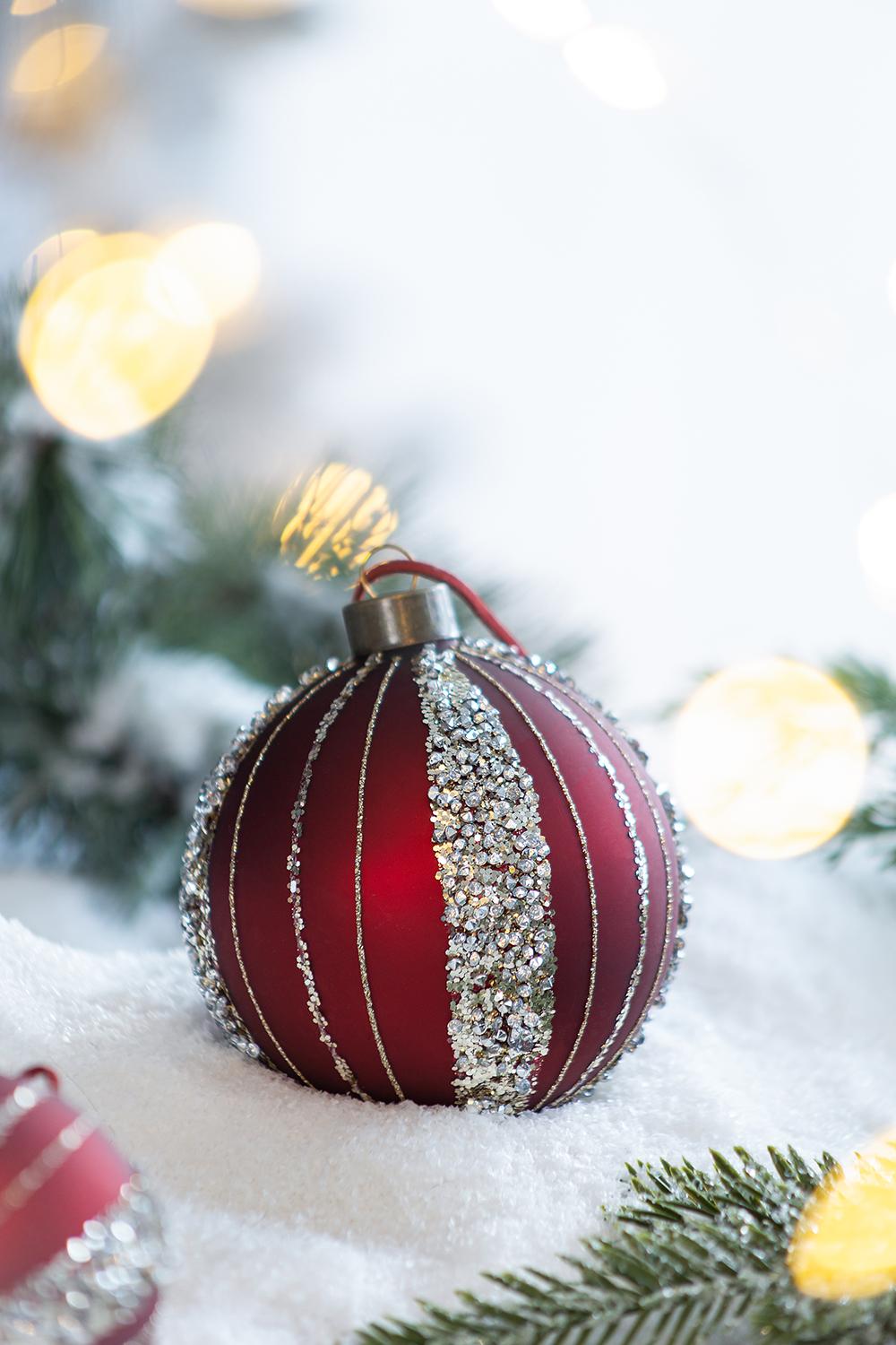 Red bauble with silver glitter stripes a festive Christmas ornament