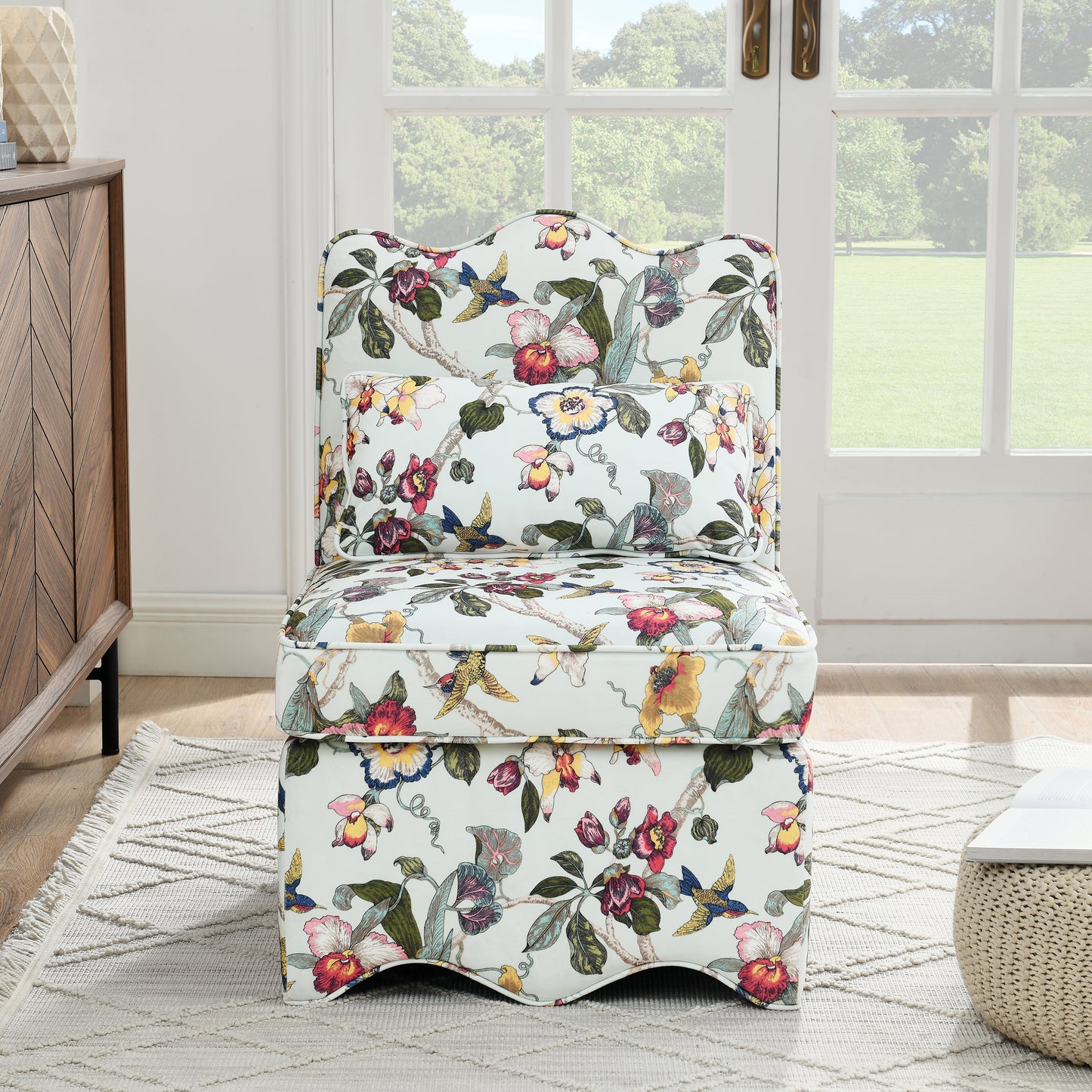 Slipper chair in light blue with colorful floral and bird print fabric for living room