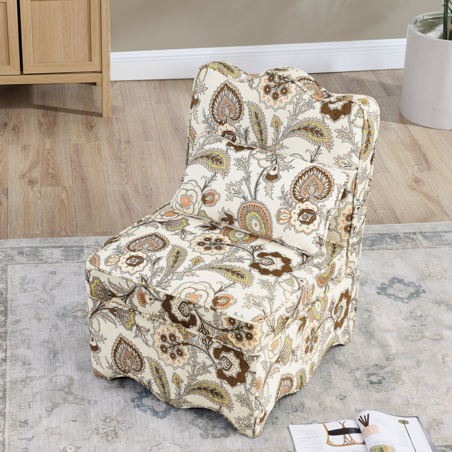 Cream floral armchair with brown and peach paisley accents perfect for a living room accent
