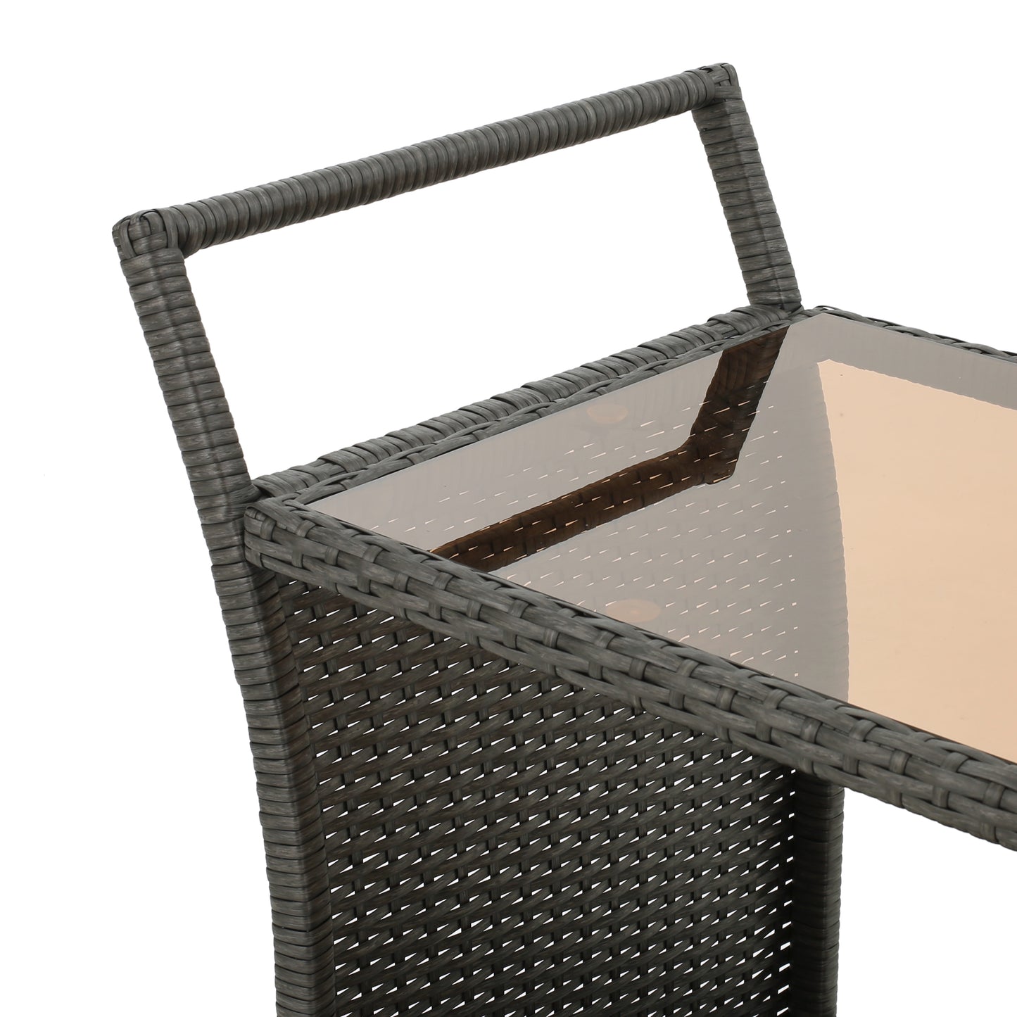 Closeup of dark grey rattan weave on a furniture frame with a glass tabletop