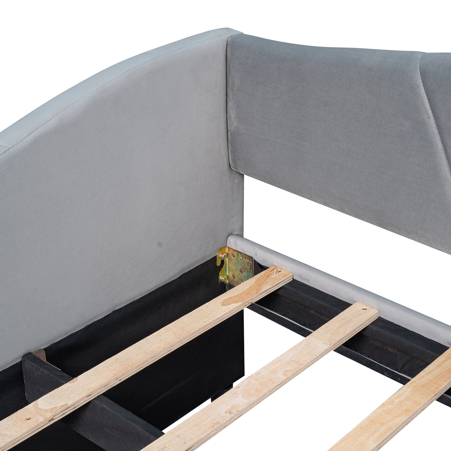 Gray upholstered headboard detail of a bed frame