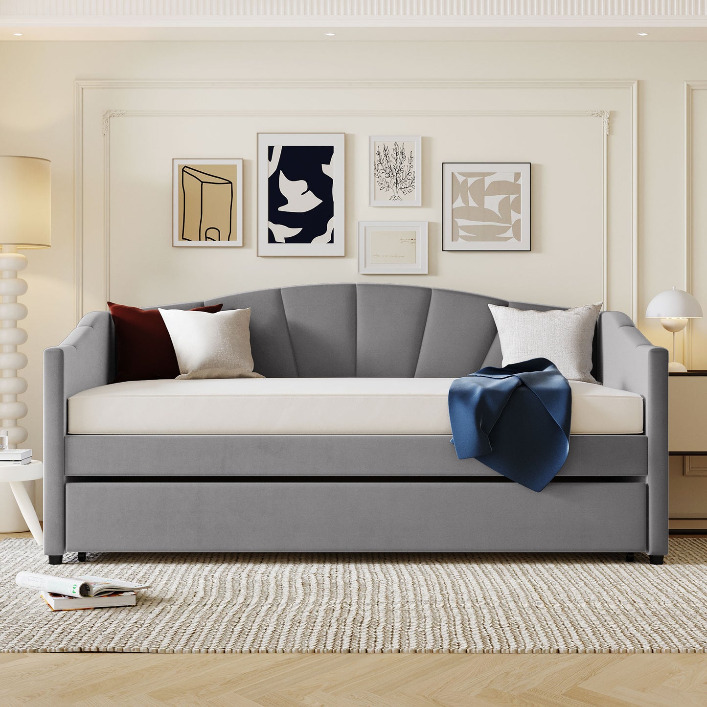Grey velvet daybed with fanshaped tufted back and pullout trundle