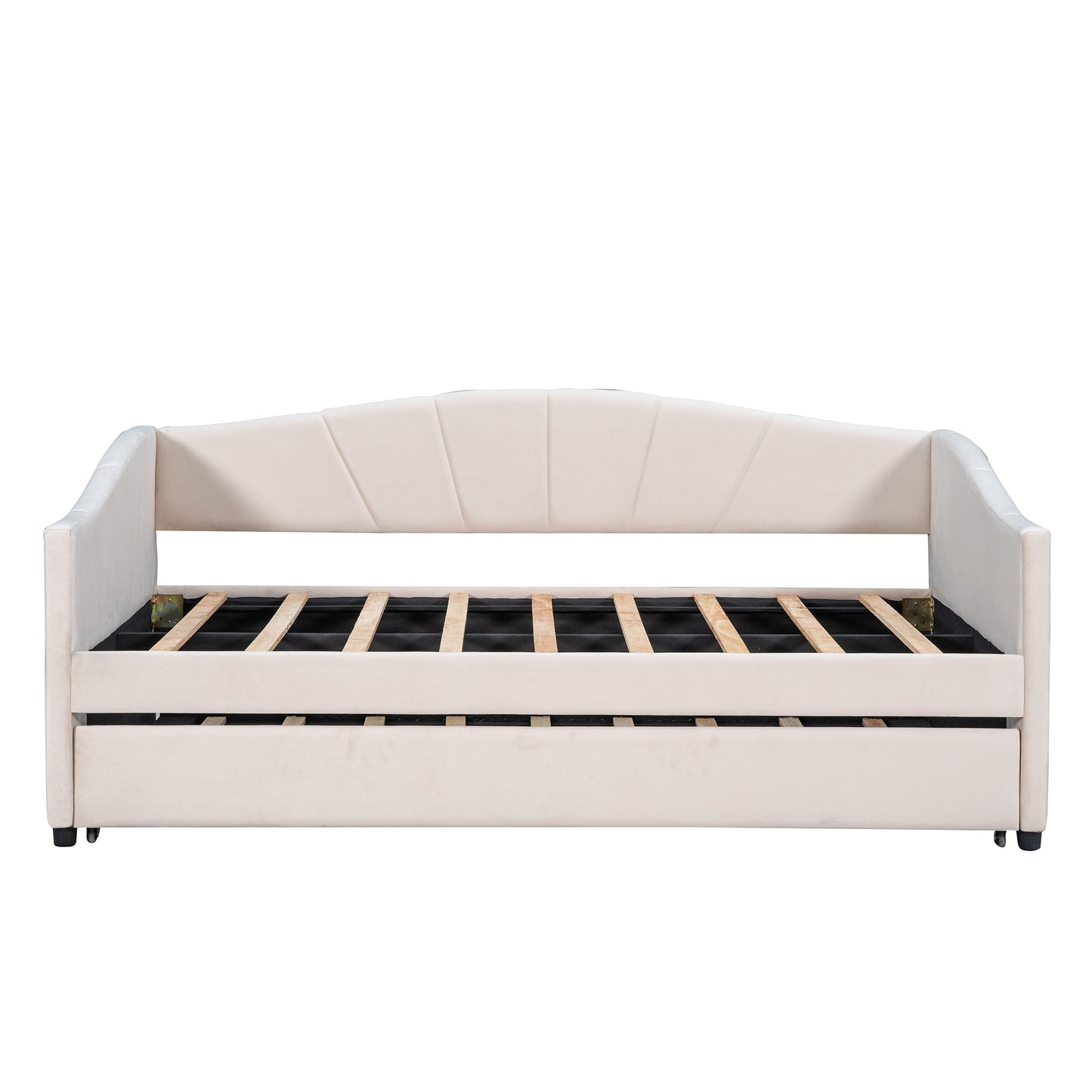 Cream velvet upholstered daybed with scalloped back and pullout trundle