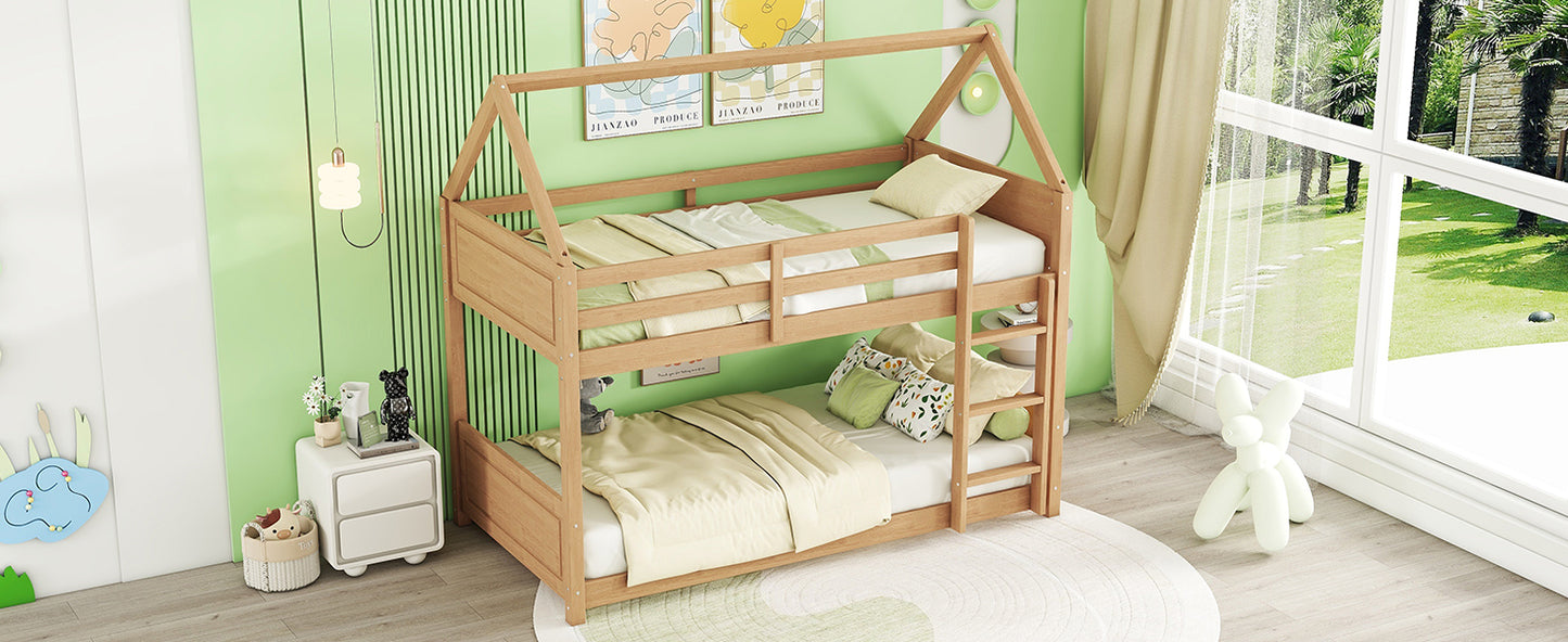 Wooden house frame bunk bed with light beige bedding and playful pillows