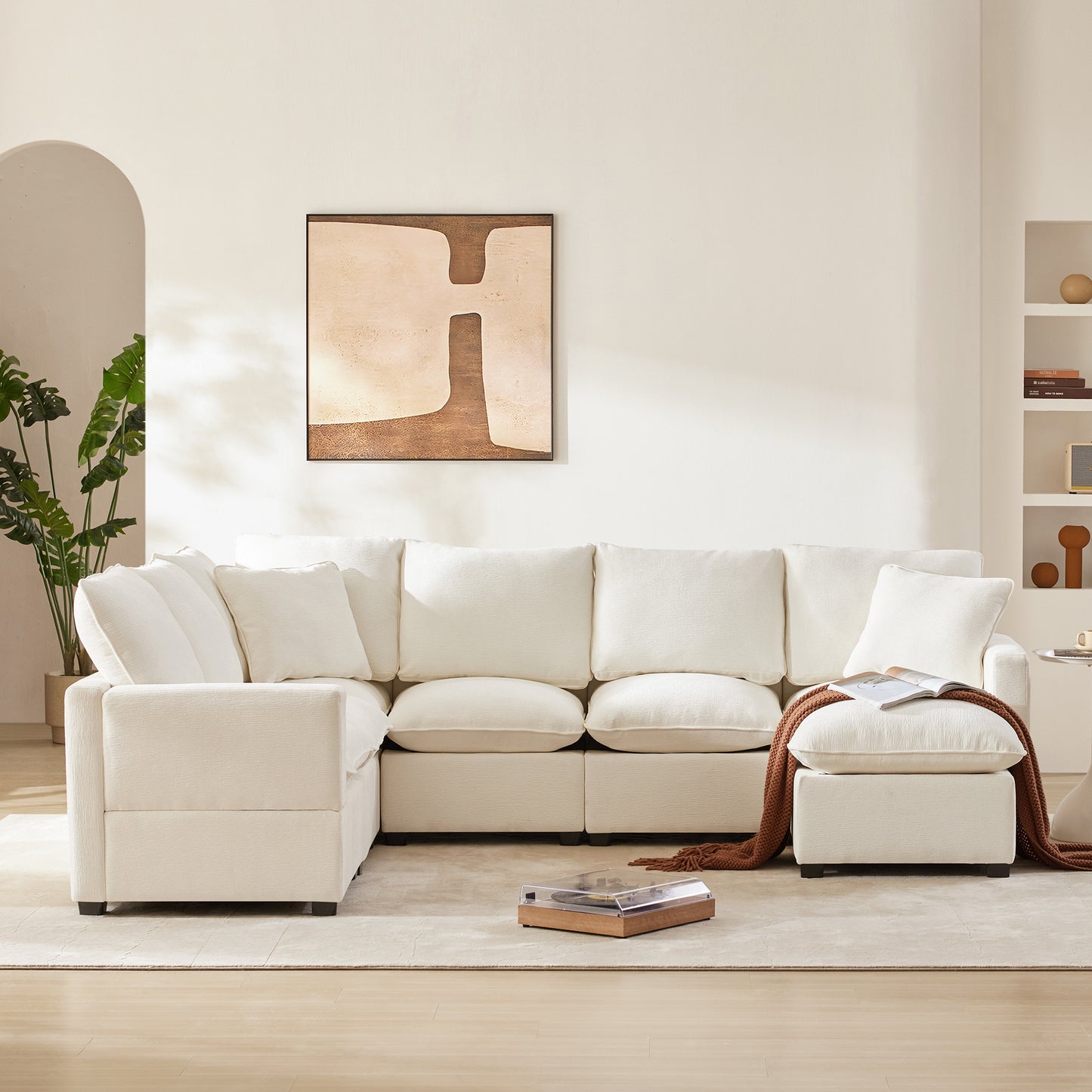 Plush cream modular sectional sofa with ample seating and cozy throw pillows