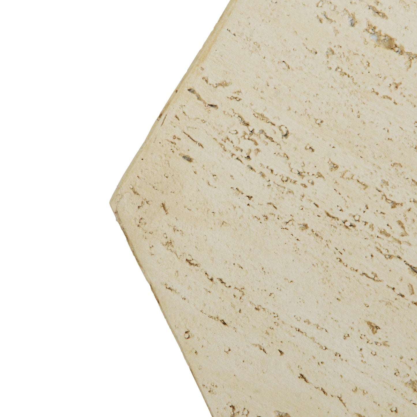 Closeup of a light beige travertine slab with natural holes and veins