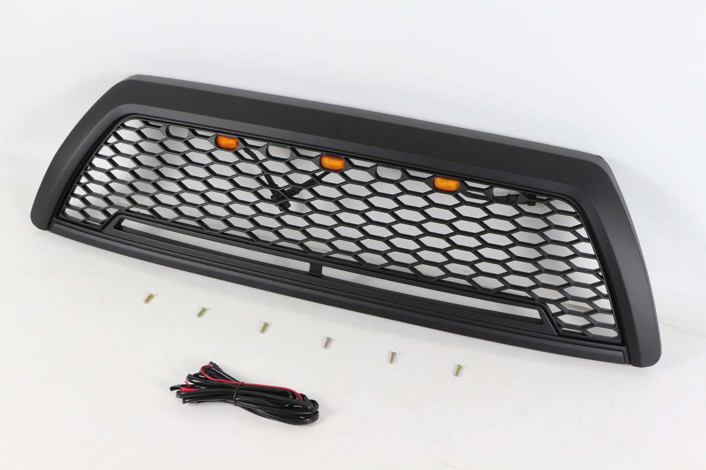 Black honeycomb raptor style grille with amber LED lights and hardware