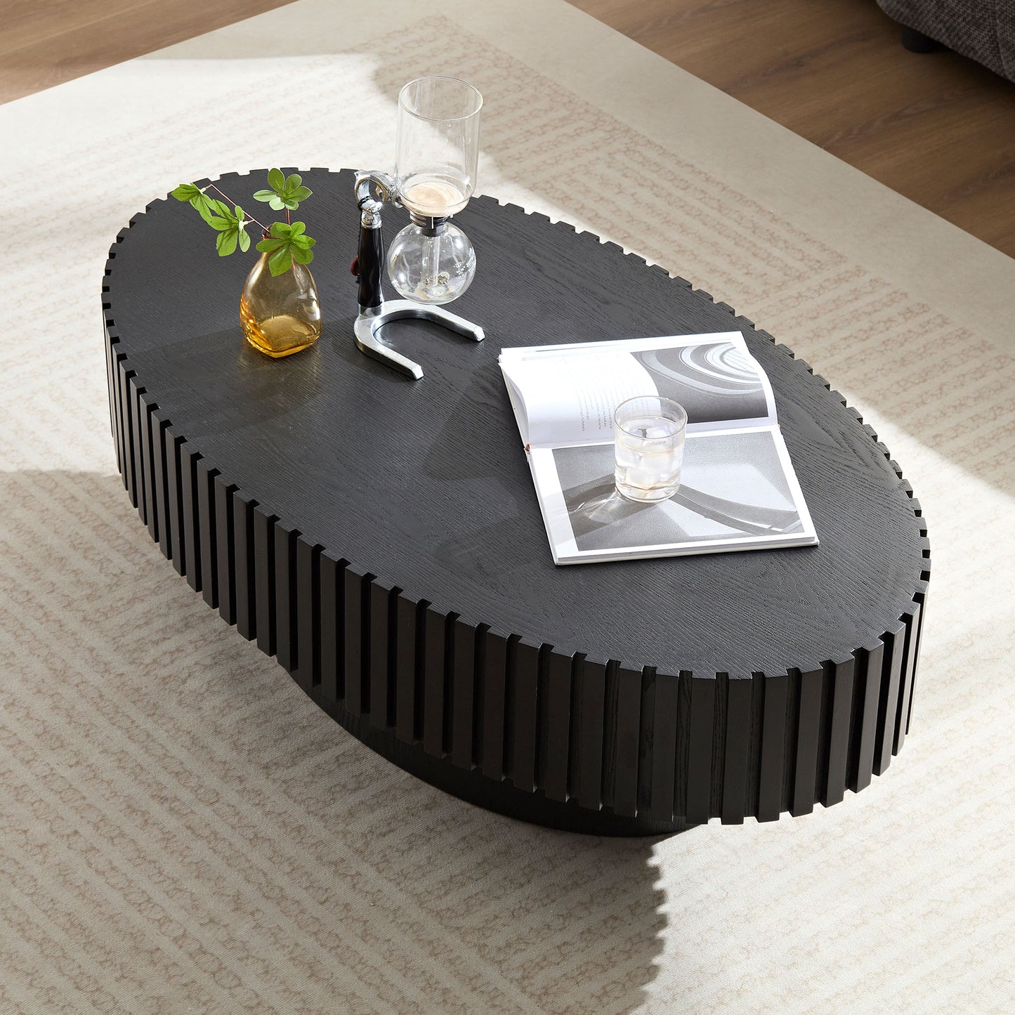 Elegant oval coffee table in dark wood with a ribbed base design