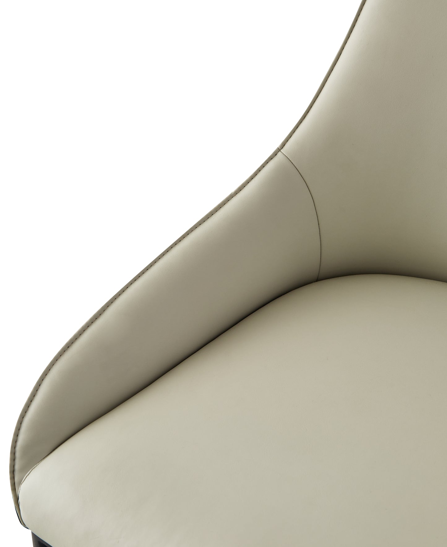 Closeup of a light beige leather accent chair with detailed stitching