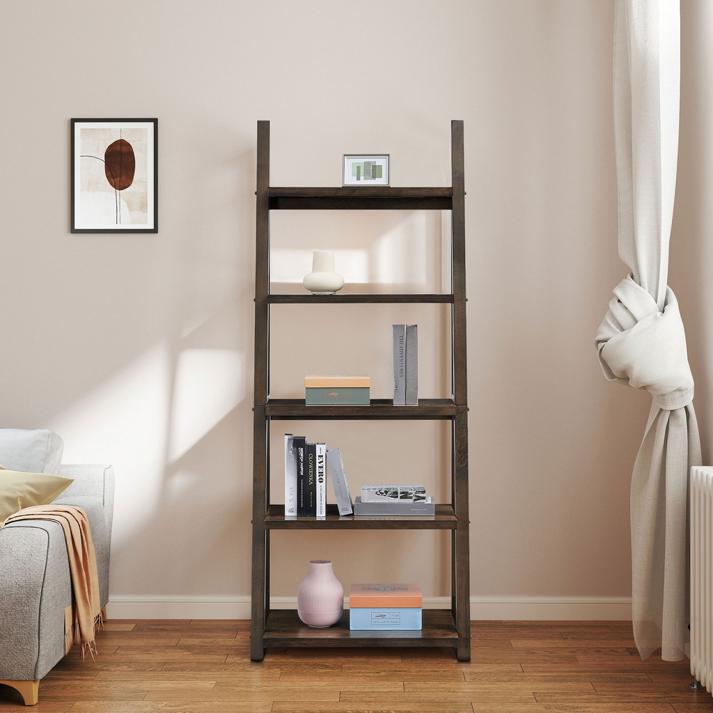 Dark wood leaning bookshelf with five shelves displaying decor and books