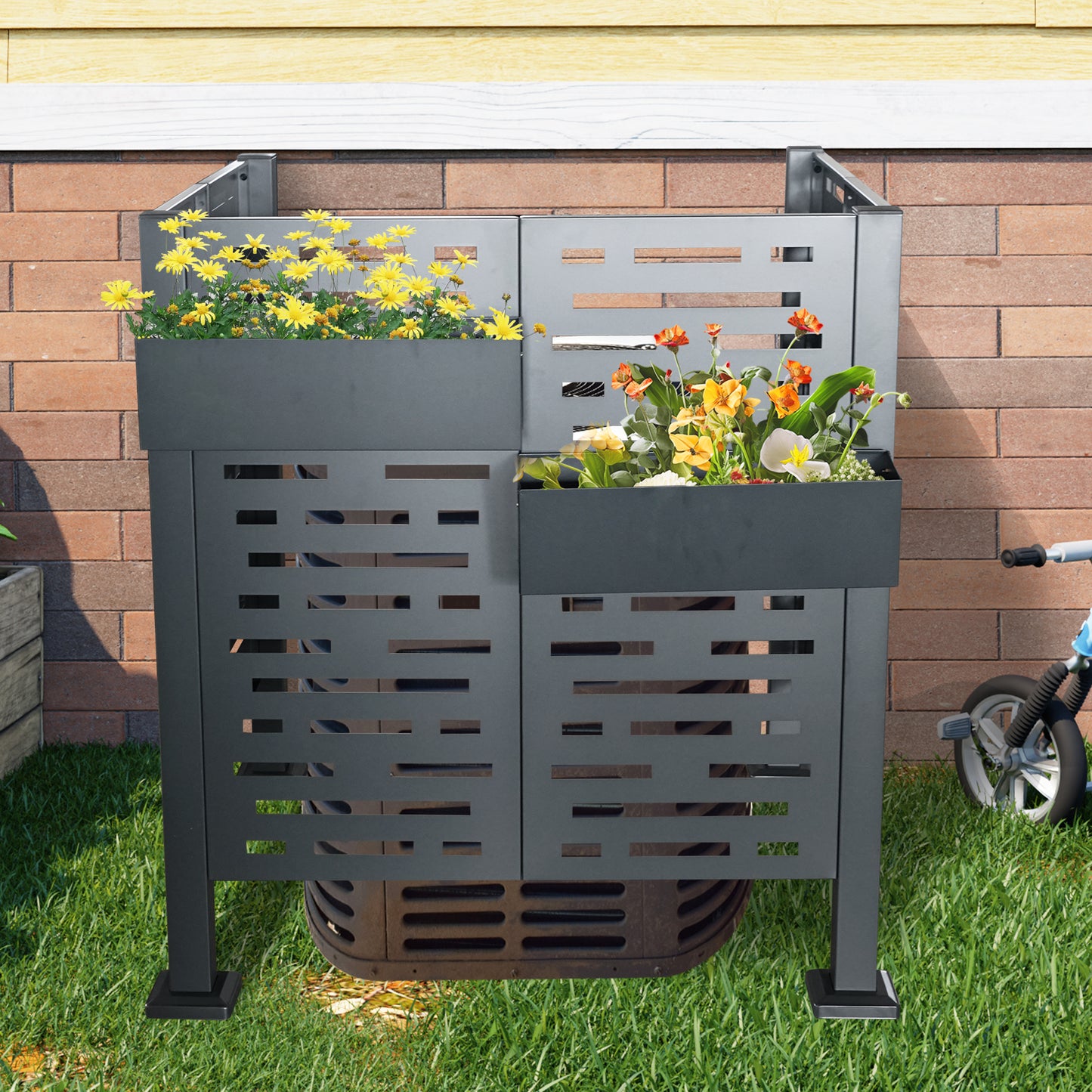 Dark gray metal outdoor AC unit screen with integrated planters of yellow and orange flowers
