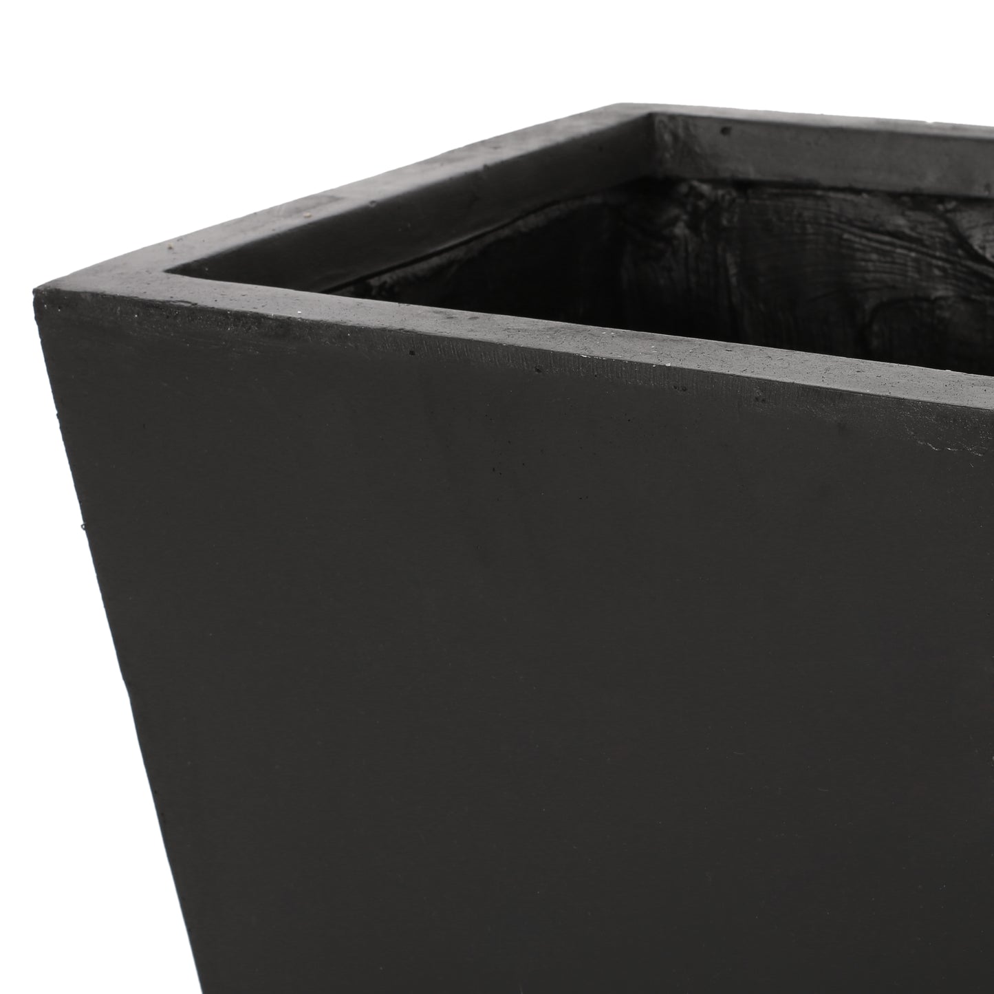 Closeup of a tall dark grey rectangular concrete planter highlighting its textured interior