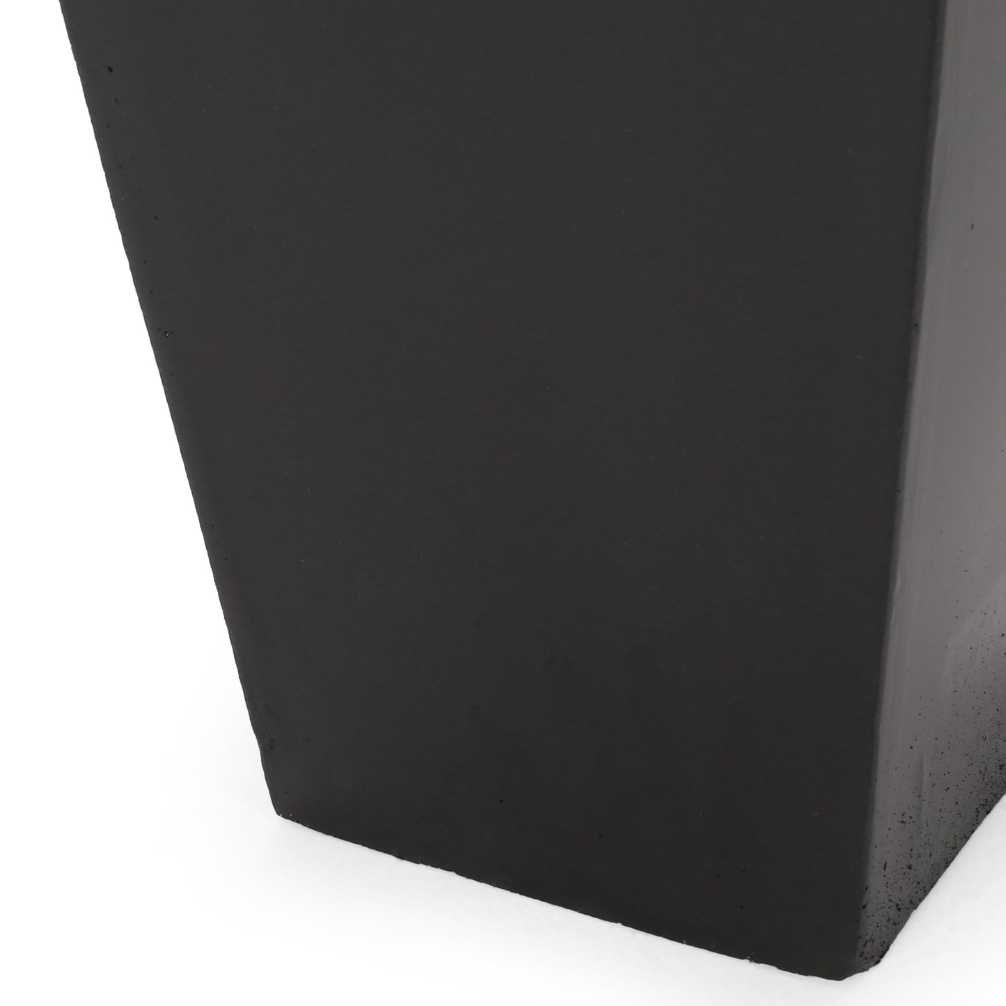 Tall black concrete planter with a modern minimalist design