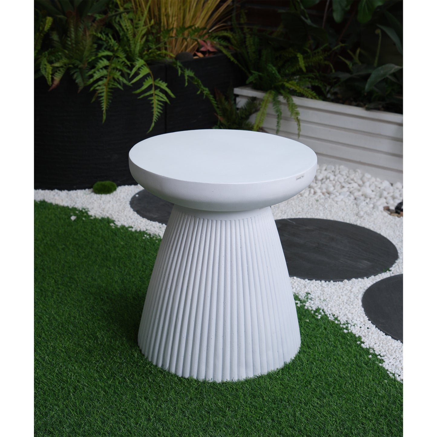 White textured garden side table with ribbed base perfect for outdoor seating areas