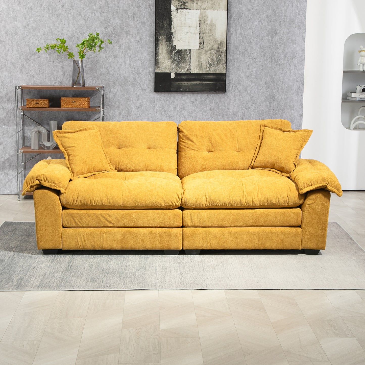Mustard yellow fabric sofa with plush cushions and two throw pillows