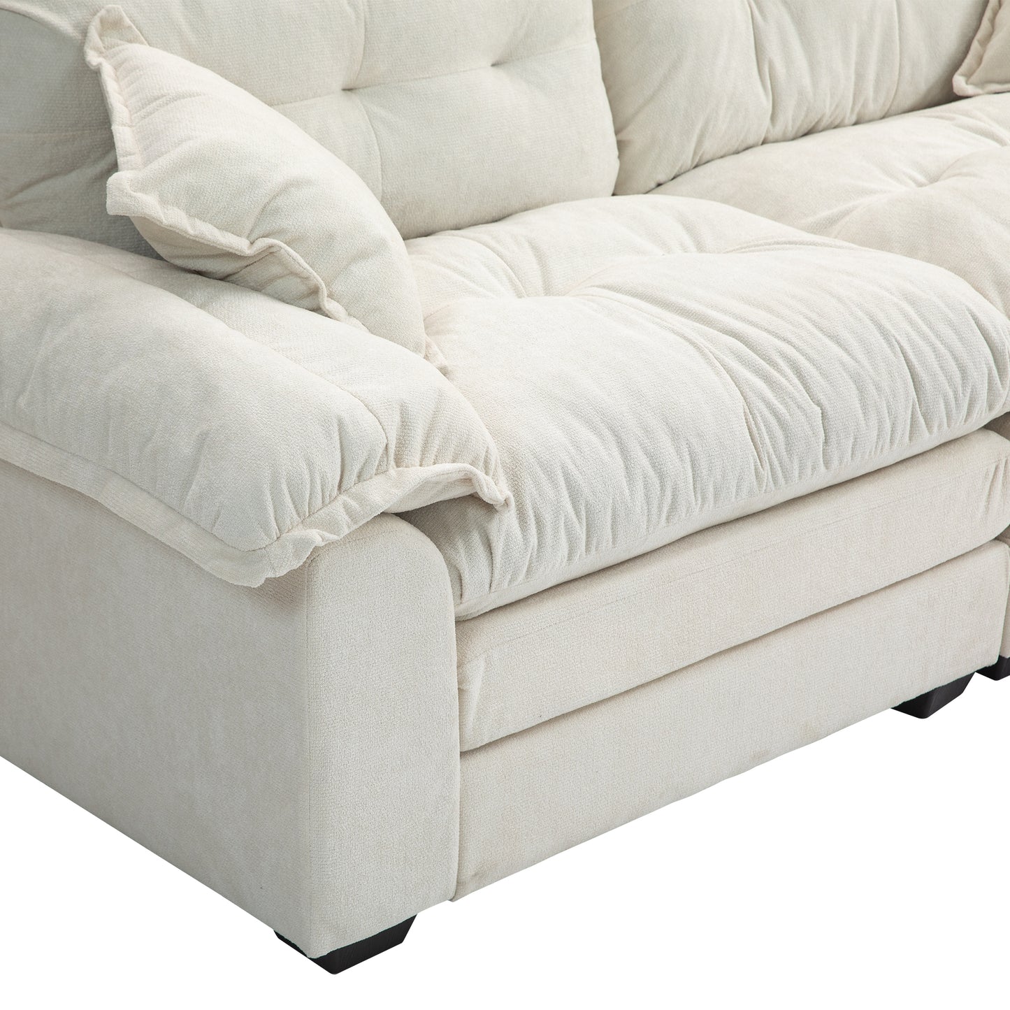Cream textured fabric sofa with deep tufted cushions and plush throw pillows