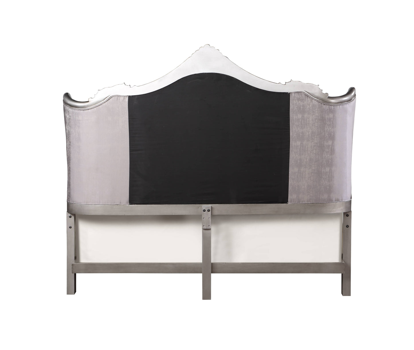 Velvet tufted headboard with silver ornate trim and a dark gray center panel
