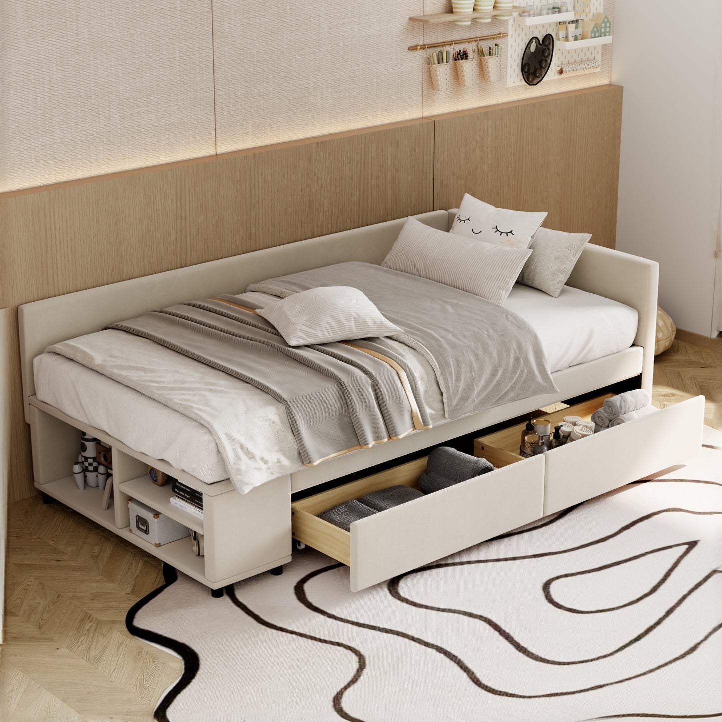 Beige upholstered daybed with storage drawers and a plush duvet set