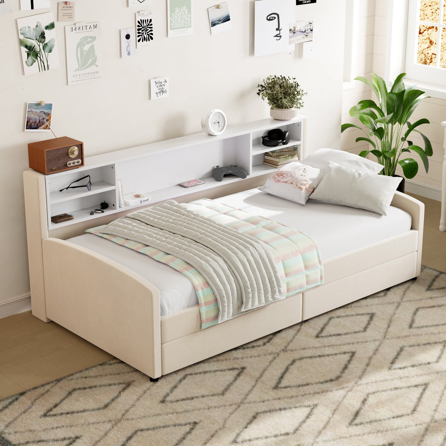 Beige upholstered twin daybed with integrated bookshelf headboard and striped quilt
