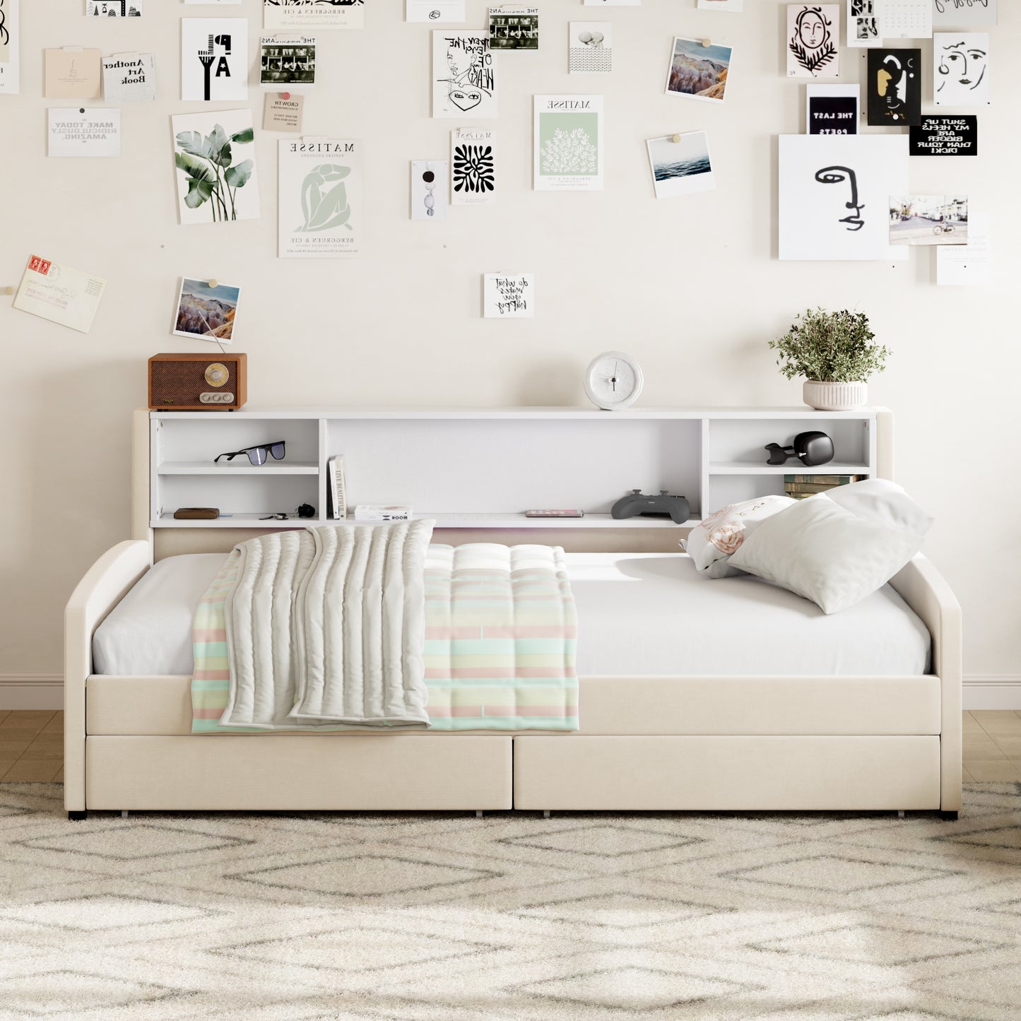 Cream upholstered twin daybed with storage drawers and attached bookcase shelf