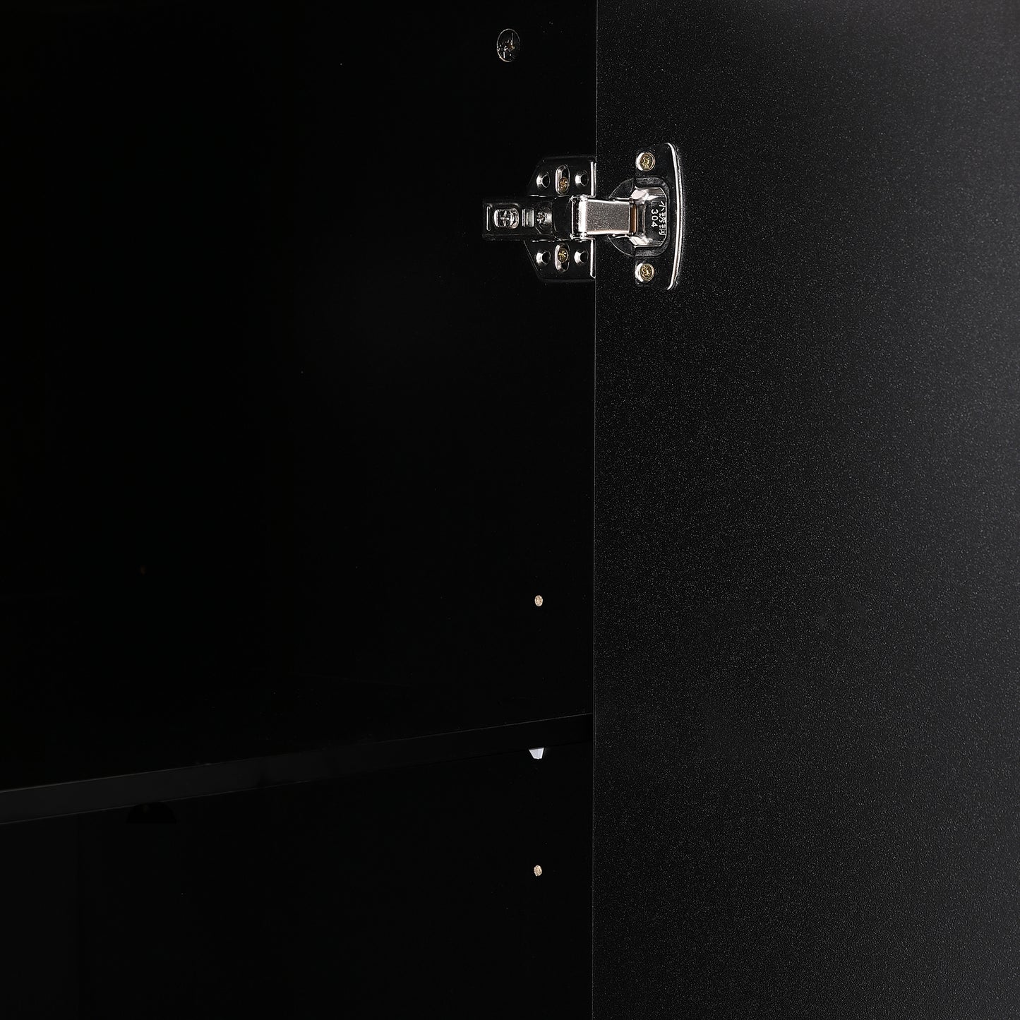 Closeup of a polished stainless steel cabinet hinge with marking