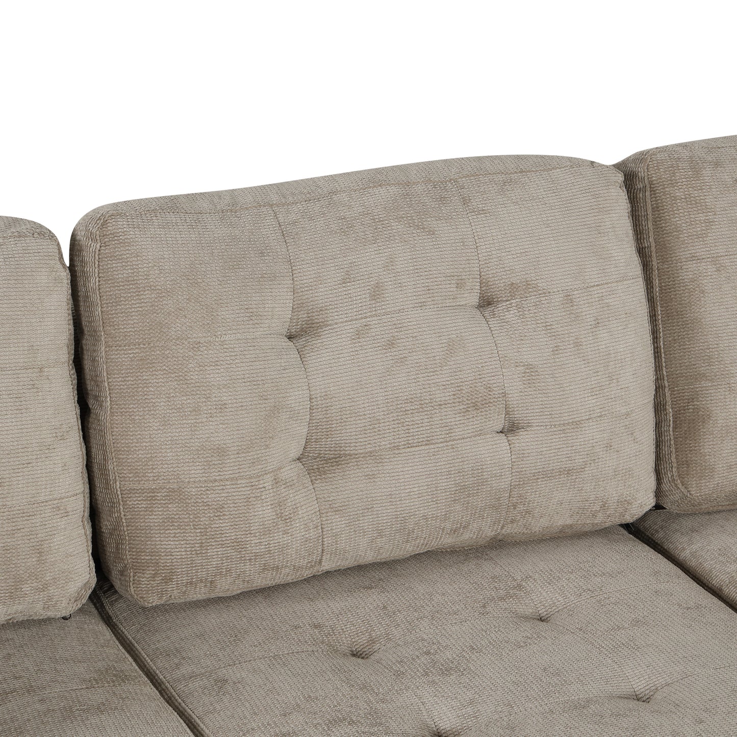 Tufted beige upholstered sofa back cushion with textured fabric detail