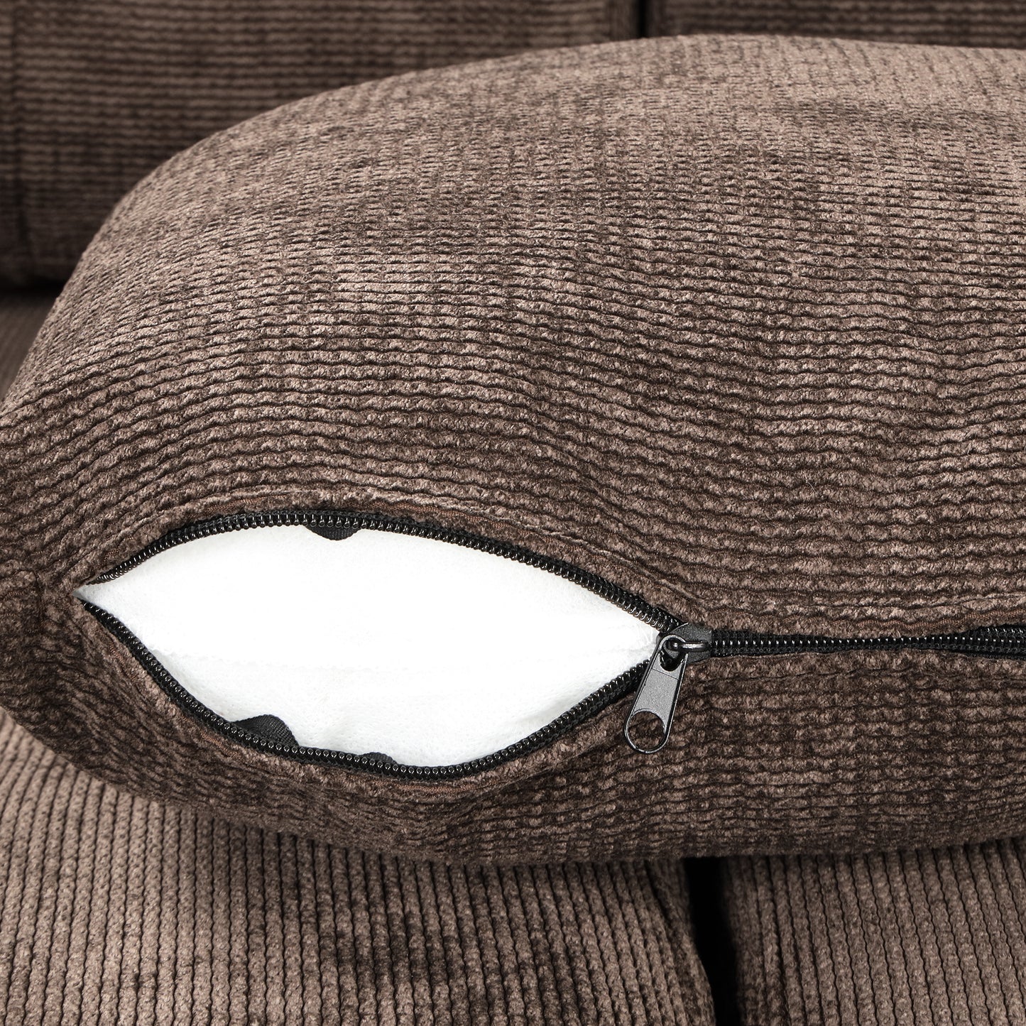 Brown textured couch pillow with visible zipper detail